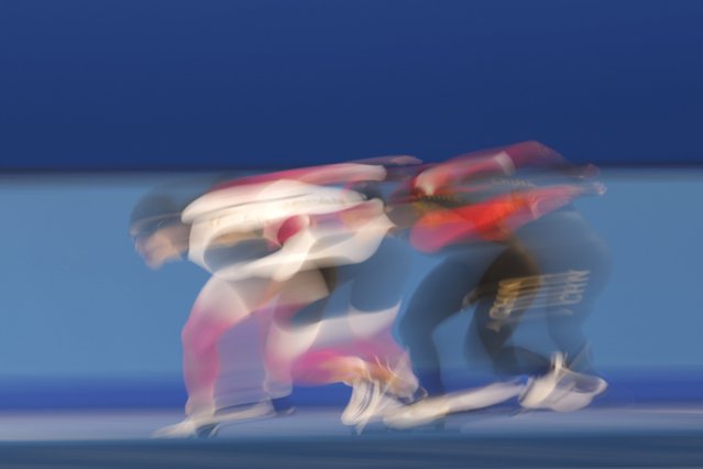 Japan's Ryota Kojima, left, and China's Ning Zhongyan compete during the men's 1000m speed skating final at the 9th Asian Winter Games in Harbin, China on Tuesday, February 11, 2025. (Photo by Aaron Favila/AP Photo)