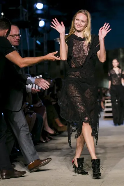 A model is helped up after falling while presenting a creation from the Givenchy Spring/Summer 2016 collection during New York Fashion Week in New York September 11, 2015. (Photo by Lucas Jackson/Reuters)