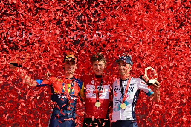 UAE Team Emirates' Slovenian rider Tadej Pogacar (C), Lidl-Trek's Italian rider Giulio Ciccone (L) and Bahrain - Victorious' Spanish rider Pello Bilbao celebrate on the podium with their trophies at the end of the 2025 UAE Tour on February 23, 2025. (Photo by Giuseppe Cacace/AFP Photo)