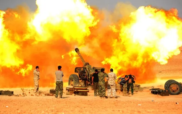 Syrian army soldiers fire an artillery on the Islamic State (IS) positions near the city of al- Bukamal in the eastern countryside of Deir al- Zour province, Syria, on November 10, 2017. The Syrian army captured al- Bukamal in the eastern countryside of Deir al- Zour province on Wednesday and officially declared its victory on Thursday. The Islamic State (IS) clawed back over 40 percent of the city of al- Bukamal, the last IS stronghold that has been recently captured by the Syrian government forces, a monitor group reported on Friday. (Photo by Ammar Safarjalani/Xinhua News Agency)
