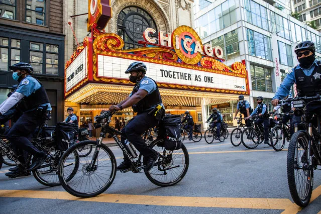 Chicago police officers on bikes follow crowds during a protest on June 13, 2020 in Chicago, Illinois. Protests erupted across the nation after George Floyd died in police custody in Minneapolis, Minnesota on May 25th. (Photo by Natasha Moustache/Getty Images)