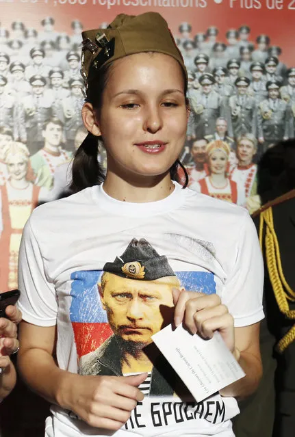 A Russian woman attending a Russian Red Army Choir performance wears a T-shirt with a picture of Russian President Vladimir Putin at Water Front Theatre in Beirut, Lebanon September 13, 2014. (Photo by Jamal Saidi/Reuters)