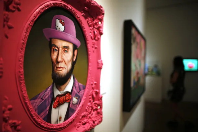 A painting titled “Hello Lincoln” by Scott Scheidly hangs at the “Hello! Exploring the Supercute World of Hello Kitty” museum exhibit in honor of Hello Kitty's 40th anniversary, at the Japanese American National Museum in Los Angeles, California October 10, 2014. (Photo by Lucy Nicholson/Reuters)