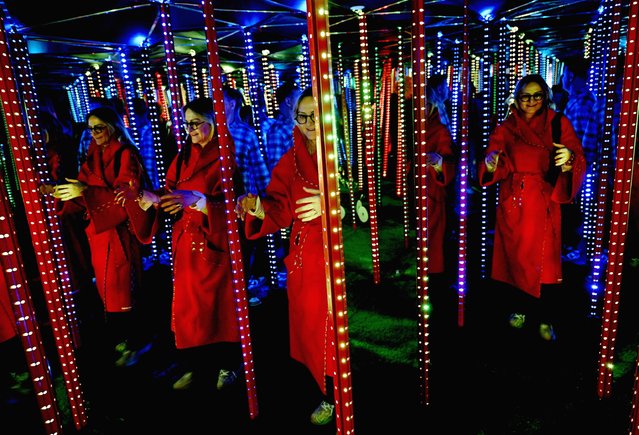 Visitors experience one of the immersive installations of the “Museum of Senses” exhibition in Milan, Italy, 13 March 2025. The exhibition will be open to the public from 14 March to 31 December 2025. (Photo by Daniel Dal Zennaro/EPA/EFE)