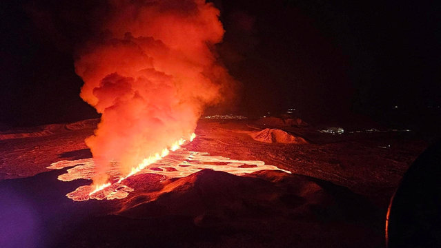 A volcano spews lava and smoke as it erupts on Reykjanes Peninsula, Iceland, on February 8, 2024. (Photo by Iceland Civil Protection/Handout via Reuters)