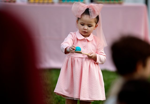 A child participates in the White House Egg Roll on the South Lawn of the White House on April 21, 2025 in Washington, DC. The White House is expecting thousands of children and adults to participate in the annual tradition of rolling colored eggs down the White House lawn, which was started by President Rutherford B. Hayes in 1878. (Photo by Chip Somodevilla/Getty Images)