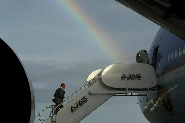 U.S. President Barack Obama boards Air Force One to depart for Panama from Norman Manley International Airport in Kingston April 9, 2015. (Photo by Jonathan Ernst/Reuters)