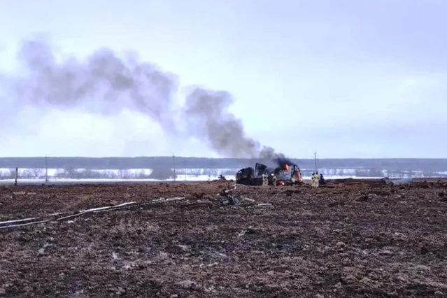 In this image made from video provided by the Russian Emergency Situations Ministry press service on Tuesday, December 20, 2022, firefighters work at the site of gas explosion, near the village of Yambakhtino, some 50km (31miles) south of Cheboksary, Chuvashia region, Russia. An explosion on a section of Europe-bound natural gas pipeline in western Russia has killed three people but hasn't affected export supplies, officials said. The explosion ripped through a section of the Urengoy-Pomary-Uzhhorod pipeline in the Chuvashia region during repair works on Tuesday. (Photo by Ministry of Emergency Situations press service via AP Photo)