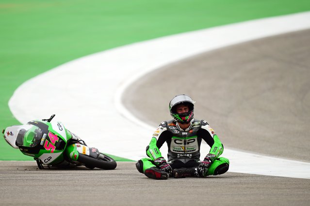 Moto3 rider Riccardo Rossi of Italy reacts after crashing during the Portuguese Motorcycle Grand Prix at the Algarve International circuit near Portimao, Portugal, Sunday, March 24, 2024. (Photo by Jose Breton/AP Photo)