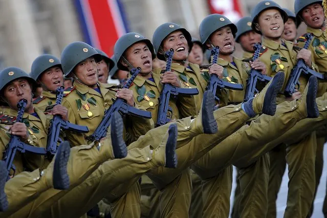 Soldiers shout slogans as they march past a stand with North Korean leader Kim Jong Un during the parade celebrating the 70th anniversary of the founding of the ruling Workers' Party of Korea, in Pyongyang October 10, 2015. (Photo by Damir Sagolj/Reuters)