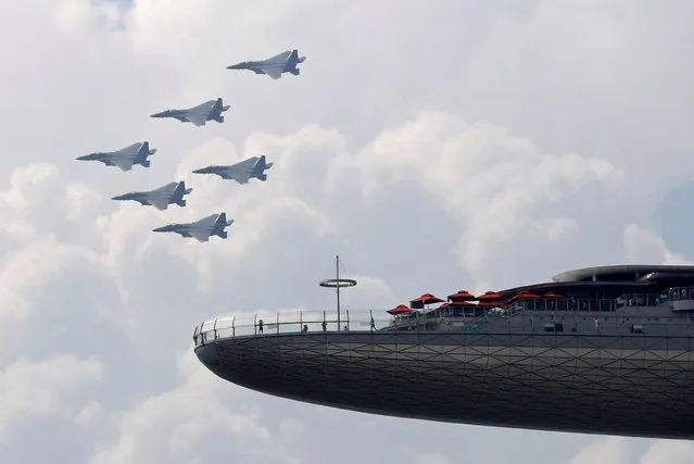 Republic of Singapore Airforce (RSAF) F15SG fly past during National Day celebrations, amidst the coronavirus disease (COVID-19) outbreak, in Singapore on August 9, 2020. (Photo by Edgar Su/Reuters)