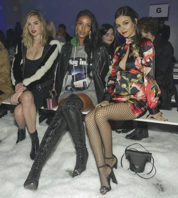 Kate Upton, from left, Maya Jama and Victoria Justice attend the Philipp Plein 2018 Fall/Winter Runway Show during New York Fashion Week at the Brooklyn Navy Yard on Saturday, February 10, 2018, in New York. (Photo by Brent N. Clarke/Invision/AP Photo)