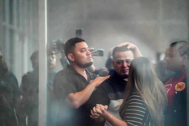 Kilmar Abrego Garcia, the migrant whose wrongful deportation to El Salvador made him a symbol of Trump's aggressive immigration policies, holds his wife Jennifer Vasquez Sura's hand, as he appears for a check-in at the ICE Baltimore field office three days after his release from criminal custody in Tennessee, in Baltimore, Maryland on August 25, 2025. (Photo by Elizabeth Frantz/Reuters)