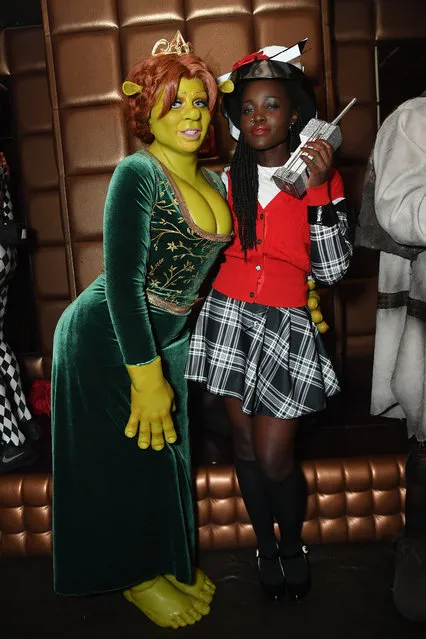 Heidi Klum as Princess Fiona from Shrek (L) and Kenyan-Mexican actress Lupita Nyong’o as Dionne from Clueless attend Heidi Klum's 19th Annual Halloween Party presented by Party City and SVEDKA Vodka at LAVO New York on October 31, 2018 in New York City. (Photo by Mike Coppola/Getty Images for Heidi Klum)