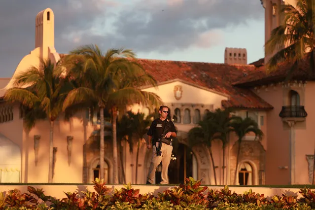 A Secret Service agent guards the Mar-a-Lago home of former President Donald Trump on March 21, 2023 in Palm Beach, Florida. Trump said on a social media post that he expects to be arrested in connection with an investigation into a hush-money scheme involving adult film actress Stormy Daniels and called on his supporters to protest any such move. However, it is unclear if he will be arrested or not. (Photo by Joe Raedle/Getty Images)