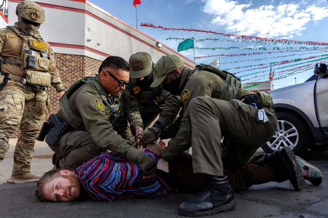 Federal agents detain a man in a parking lot in the Avondale neighborhood following a confrontation during immigration raids, after U.S. President Donald Trump ordered increased federal law enforcement presence to assist in crime prevention, in Chicago, Illinois, U.S., October 25, 2025. (Photo by Jim Vondruska/Reuters)