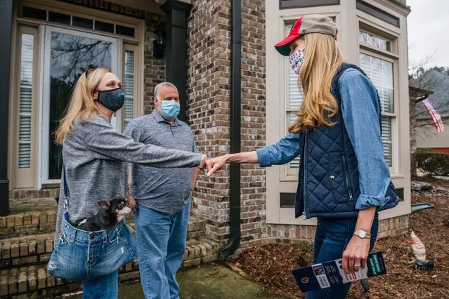 Senator Kelly Loeffler (R), greets neighborhood residents during a canvassing event on January 2, 2021 in Loganville, Georgia. In the lead-up to the January 5 runoff election, Georgia Republican Senator Kelly Loeffler continues to focus on early voting efforts across the state of Georgia. (Photo by Brandon Bell/Getty Images)