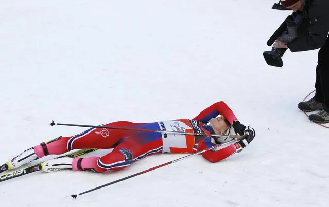 Marit Bjoergen of Norway reacts after winning the FIS Tour de ski after the women's FIS Tour de ski cross-country skiing 9km final climb free pursuit race on the Alpe Cermis in Val di Fiemme January 11, 2015. (Photo by Alessandro Garofalo/Reuters)