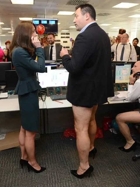 Kate Duchess of Cambridge meets trader Nigel Hagen, wearing high heel shoes as she attends ICAP's 23rd annual Charity Day in London Wednesday December 9, 2015.  (Photo by Jeremy Selwyn, Pool via AP Photo)