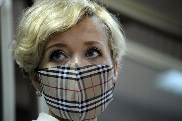 Anastasia Shevchenko, wearing a face mask to protect prevent the spread of coronavirus, attends a court hearing in a courtroom in Rostov-on-Don, Russia, Thursday, February 18, 2021. Shevchenko, a member of the Open Russia opposition movement, is the first political activist in Russia prosecuted for participating in an “undesirable organization”, a criminal charge punishable by up to six years in prison. (Photo by AP Photo/Stringer)