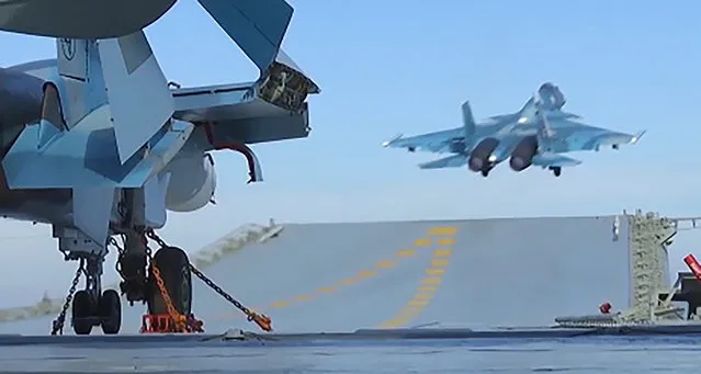 An image grab taken from a video footage made available on the Russian Defence Ministry's official website on November 15, 2016, reportedly shows a jet taking off from the Admiral Kuznetsov aircraft carrier in the eastern Mediterranean off the Syrian coast during a strike against Islamic State (IS) group's positions in Syria. Russian Defence Minister Sergei Shoigu said on November 15 that jets from the Admiral Kuznetsov aircraft carrier deployed in the eastern Mediterranean had launched their first strikes on Syria. (Photo by AFP Photo/Russian Defence Ministry)