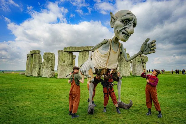 A giant puppet, controlled by four people, called Gnomus, the Caretaker of the Earth, performs at Stonehenge, near Amesbury, Wiltshire on Friday, April 29, 2022. (Photo by Ben Birchall/PA Images via Getty Images)
