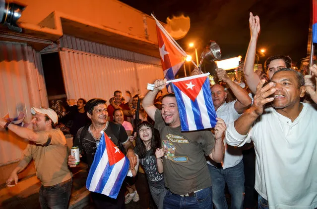 People celebrate the death of Cuban leader Fidel Castro, in Little Havana, Miami, Florida, U.S. November 26, 2016. (Photo by Gaston De Cardenas/Reuters)