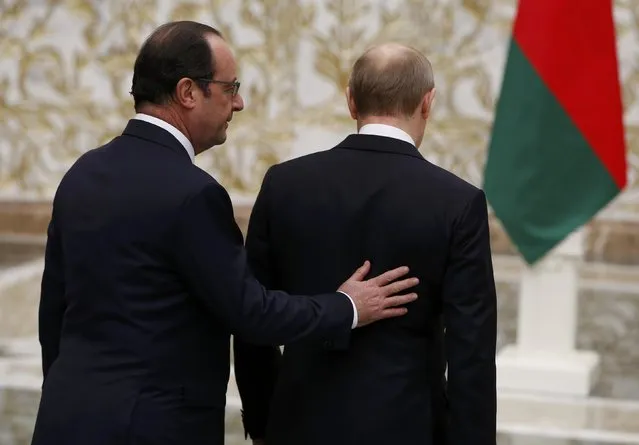 French President Francois Hollande and Russian President Vladimir Putin (R) walk after a meeting in Minsk, February 11, 2015. (Photo by Grigory Dukor/Reuters)