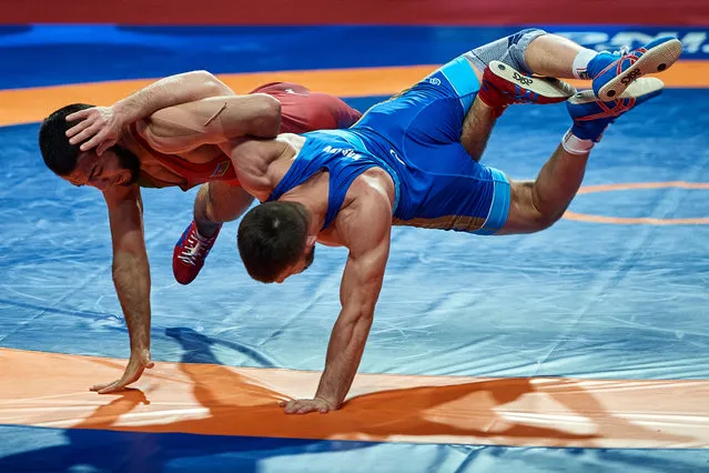 Turan Bayramov (red) from Azerbaijan fights with Israil Kasumov (blue) from Russia at Final Free Style 70 kg weight during 2021 Senior European Championships United World Wrestling at Torwar Hall on April 20, 2021 in Warsaw, Poland. (Photo by Adam Nurkiewicz/Getty Images)