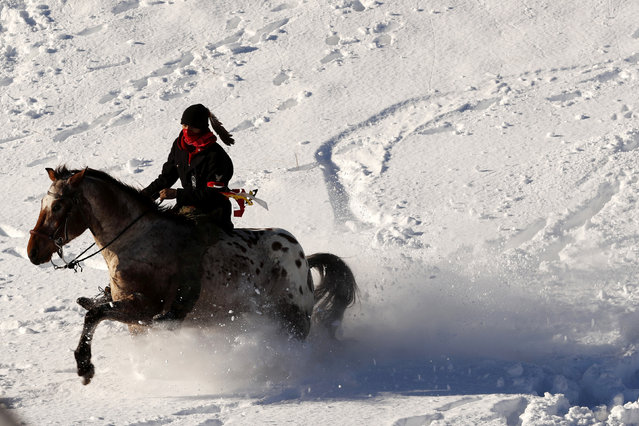 A young Native American man rides his horse through the snow near the Oceti Sakowin camp as “water protectors” continue to demonstrate against plans to pass the Dakota Access pipeline near the Standing Rock Indian Reservation, near Cannon Ball, North Dakota, U.S., December 4, 2016. (Photo by Lucas Jackson/Reuters)