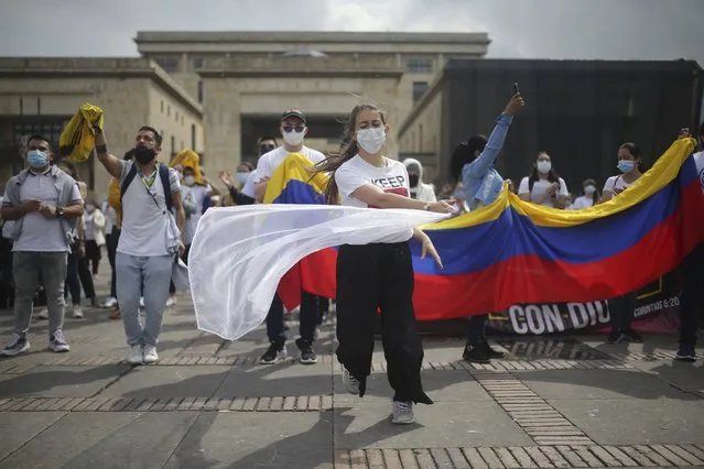 Christians gather in prayer asking for the violence during anti-government protests to stop, in Bolivar Square in Bogota, Colombia, Saturday, May 8, 2021. (Photo by Ivan Valencia/AP Photo)