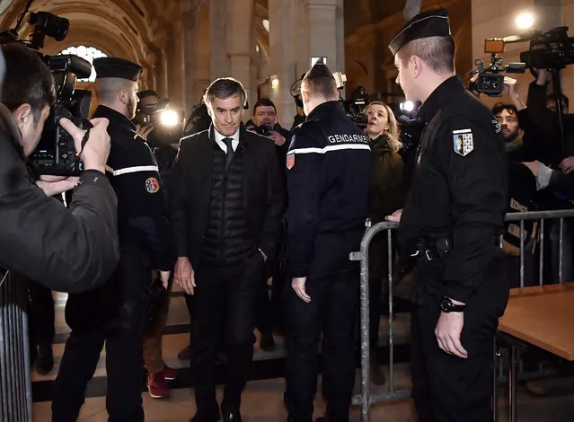 French former budget minister Jerome Cahuzac arrives at Paris courthouse for the verdict of his tax fraud trial on December 8, 2016. The 64- year- old former rising star in the French Socialist Party faces charges of tax evasion and money laundering as well as under- declaring the value of his fortune when he took up his post in 2012. Prosecutors have called for a three- year jail term and a two- year sentence for his co- defendant and ex- wife, dermatologist Patricia Menard The pair, who ran a hair transplant clinic with a client list featuring members of Paris' s high society, have already paid back taxes and penalties totalling some 2.5 million euros ($2.8 million). (Photo by Philippe Lopez/AFP Photo)