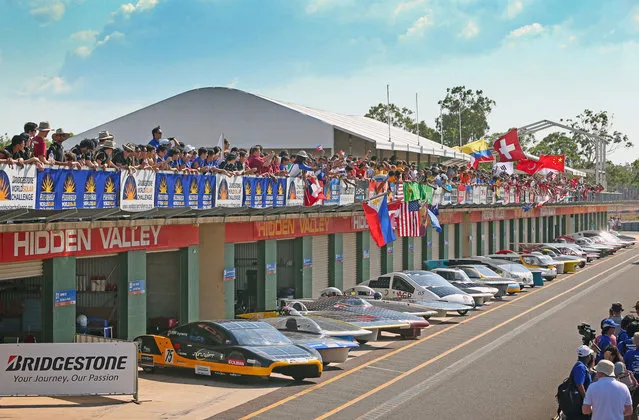 All 40 solar cars and team members involved in the Bridgestone World Solar Challenge pose for a photograph at the Hidden Valley Motor Sports Complex on October 4, 2013 in Darwin, Australia. Over 25 teams from across the globe will compete in the 2013 World Solar Challenge – a 3000 km solar-powered vehicle race between Darwin and Adelaide. The race begins on October 6th with the first car expected to cross the finish line on October 10th.  (Photo by Scott Barbour/Getty Images for the World Solar Challenge)