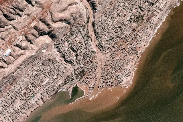 This handout satellite picture created and released by BlackSky on September 13, 2023 shows a general view of destruction in the wake of floods after the Mediterranean storm “Daniel” in Libya's eastern coastal city of Derna. A global effort to assist stricken Libya gathered pace on September 14 after a tsunami-like flood killed nearly 4,000 people and left thousands missing. Military transport aircraft from Middle Eastern and European nations, along with ships, have been ferrying emergency aid to the North African country already scarred by war. (Photo by BlackSky/AFP Photo)