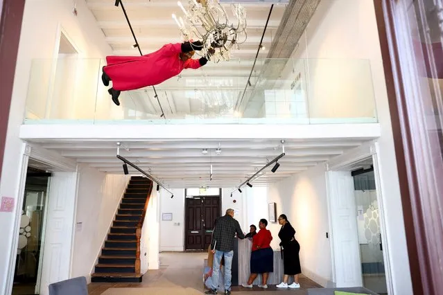 Late South Africa's anti-apartheid activist Desmond Tutu, who would have turned 92-years-old on the 7th of October, is depicted as a sculpture swinging from a chandelier at the Desmond and Leah Tutu building in Cape Town, South Africa on October 6, 2023. (Photo by Esa Alexander/Reuters)