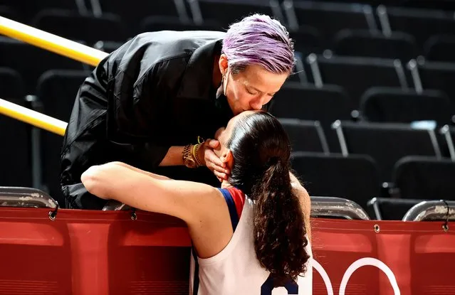 Sue Bird #6 of the United States is congratulated by partner US soccer player Megan Rapinoe after the United States victory during the Japan vs USA basketball final for women at the Saitama Super Arena during the Tokyo 2020 Summer Olympic Games on August 8, 2021 in Tokyo, Japan. (Photo by Sergio Perez/Reuters)