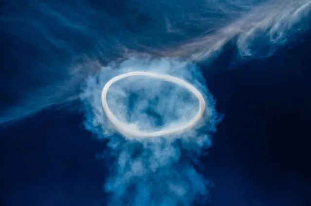 Smoke rings, composed of a mixture of smoke, steam and other gases expelled at high speed, above the Etna on August 09, 2023 in Catania, Italy. The smoke rings, a rare and fascinating sight in recent days, are emitted from a single vent located in one of its most active craters. Etna's volcanic activity seen during a training session of the SAGF, the mountain rescue team of the Italian Guardia di Finanza, from Nicolosi, which operates on the highest active volcano on the Eurasian plate. (Photo by Fabrizio Villa/Getty Images)