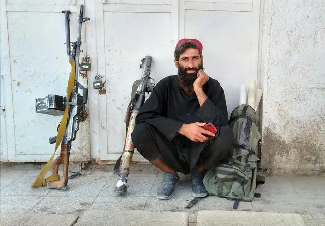 Taliban fighter is seen inside the city of Farah, capital of Farah province southwest of Kabul, Afghanistan, Wednesday, August 11, 2021. (Photo by Mohammad Asif Khan/AP Photo)