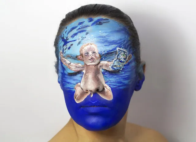 Nirvana album. She was overwhelmed with responses and as a result painted 40 different album covers on her face, including Nirvana’s “Nevermind”, King Crimson’s “The Court of the Crimson King” and “Melt” by Peter Gabriel. (Photo by Natalie Sharp/Caters News)