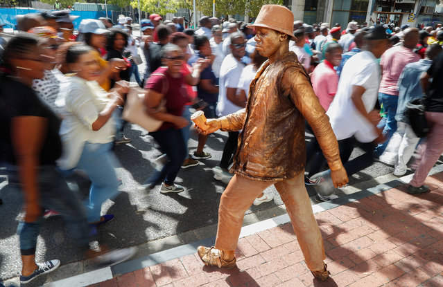 Around 200 South African police in plain clothes protest outside of the Parliament in Cape Town, South Africa, 19 March 2019. The police are protesting against failed police promotion policies. Police Minister Bheki Cele issued a statement that the protest of essential services members such as police officers is not legal and called on those who are demonstrating to report to their posts immediately. (Photo by Nic Bothma/EPA/EFE)