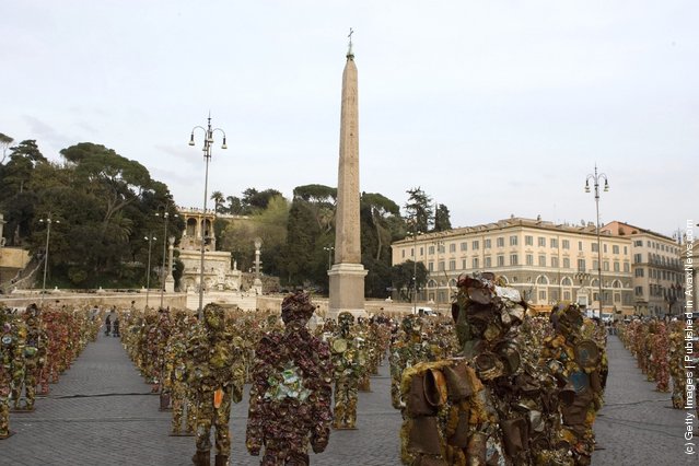Trash People, life-size representations of people created from consumer refuse like tin cans and metal containers, created by German artist Ha Schult, populate the Piazza del Popolo on March 23, 2007 in downtown Rome, Italy