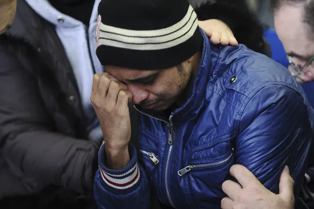 A relative of the plane crash victim sobs as he is comforted by other relatives at the Rostov-on-Don airport, about 950 kilometers (600 miles) south of Moscow, Russia Saturday, March 19, 2016. An airliner from Dubai crashed early Saturday while landing in the southern Russian city of Rostov-on-Don in strong winds, Russian officials said. (Photo by AP Photo)