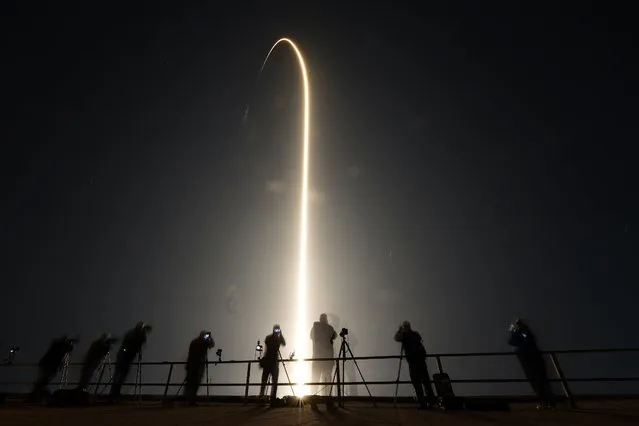 A SpaceX Falcon 9 rocket lifts off in this time-exposure photo, from Launch Pad 39A Sunday, March 3, 2024, at the Kennedy Space Center in Cape Canaveral, Fla. Four astronauts are beginning a mission to the International Space Station. (Photo by Chris O'Meara/AP Photo)