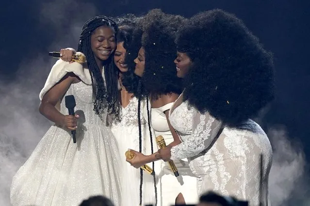 Faith Fennidy, from left, Madeline Edwards, Mickey Guyton, and Brittney Spencer embrace after a performance at the 55th annual CMA Awards on Wednesday, November 10, 2021, at the Bridgestone Arena in Nashville, Tenn. (Photo by Mark Humphrey/AP Photo)