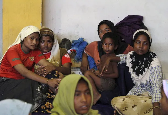 Migrants believed to be Rohingya rest inside a shelter after being rescued from boats, in Lhoksukon, Indonesia's Aceh Province May 11, 2015. (Photo by Roni Bintang/Reuters)