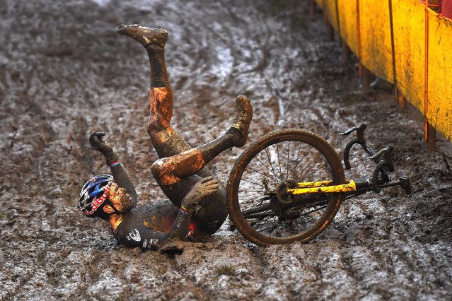 Wout Van Aert of Belgium and Team Jumbo – Visma falls on a muddy sector during the 7th Superprestige Cyclocross Boom 2021 on December 04, 2021 in Boom, Belgium. (Photo by Luc Claessen/Getty Images)