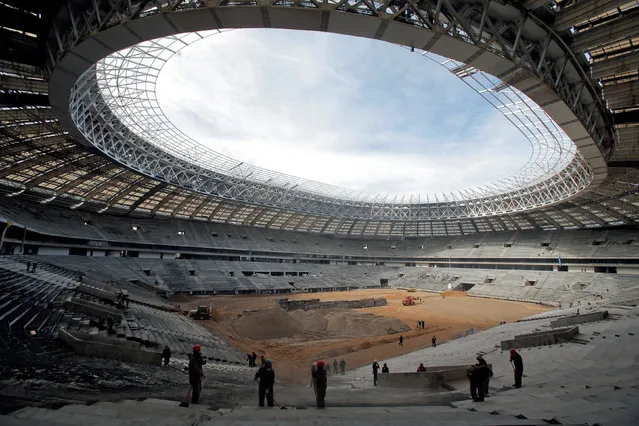 Labourers work at the Luzhniki Stadium, which is under construction for the 2018 World Cup, in Moscow, Russia, April 19, 2016. (Photo by Maxim Shemetov/Reuters)