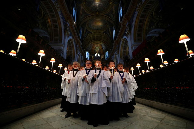 Choristers from St Paul's Cathedral choir take part in a rehearsal photocall at the cathedral in London, Britain, December 21, 2021. (Photo by Hannah McKay/Reuters)