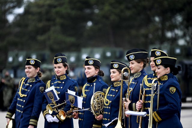 Members of Kosovo Security Forces (KSF) ceremonial band attend a ceremony to mark the 13th anniversary of Kosovo's declaration of independence in Pristina on February 17, 2021. (Photo by Armend Nimani/AFP Photo)