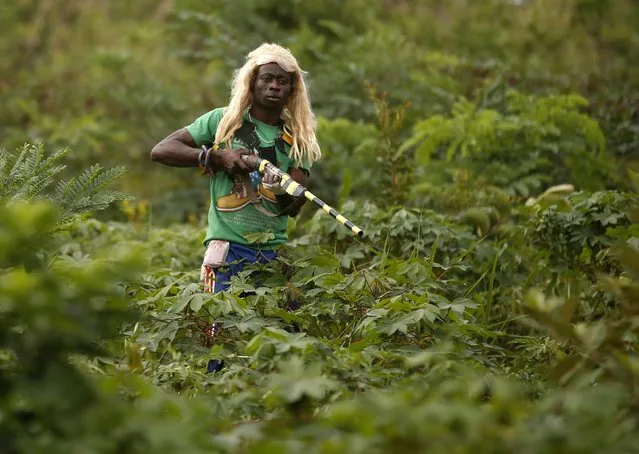 A member of the anti-balaka, a Christian militia, patrols outside the village of Zawa  April 8, 2014. (Photo by Goran Tomasevic/Reuters)